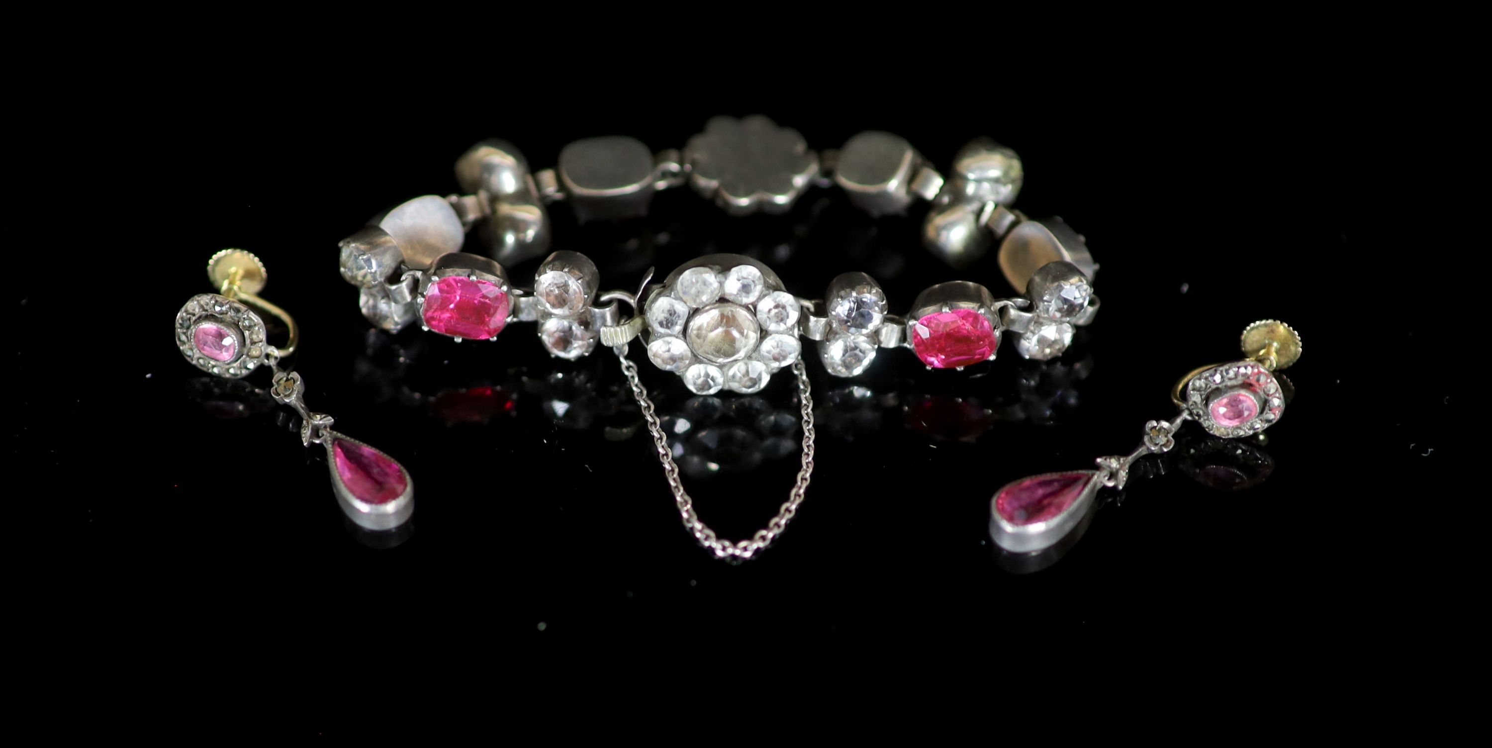 A silver and two colour paste set bracelet and a pair of gold and silver, marcasite and pink paste set drop ear clips